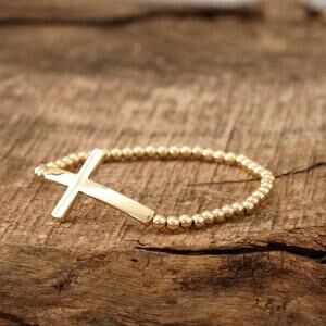 Minimal Cross Stretch Bracelet with Gold Ball Beads